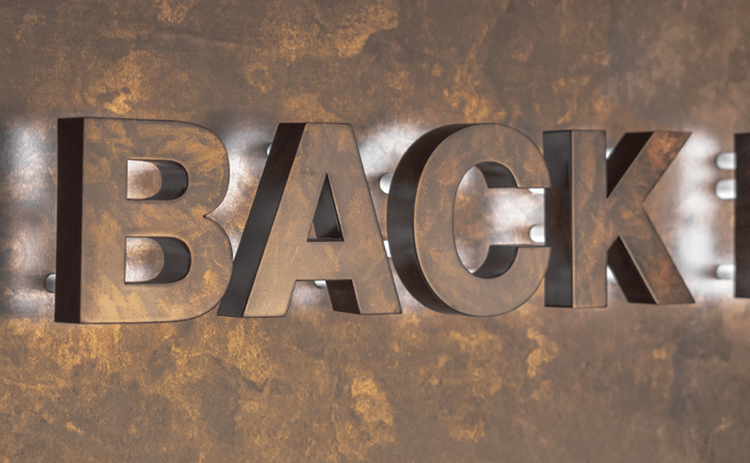 壁の色柄に合わせて塗装されているサイン